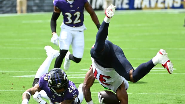 Sep 10, 2023; Baltimore, Maryland, USA; Houston Texans running back Dameon Pierce (31) is tackled by Baltimore Ravens cornerback Ronald Darby (28) during the first half at M&T Bank Stadium. Mandatory Credit: Brad Mills-USA TODAY Sports 